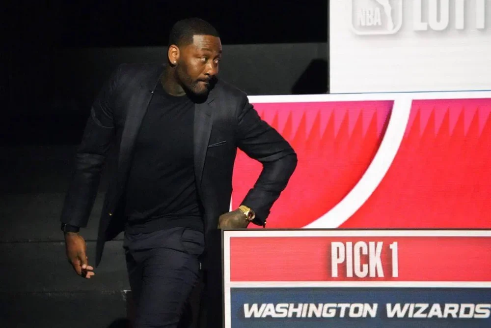 John Wall looks off the his left in reaction to the Wizards' getting the No. 1 pick.